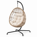 Fauteuil suspendu en rotin avec coussins beiges, structure en acier
